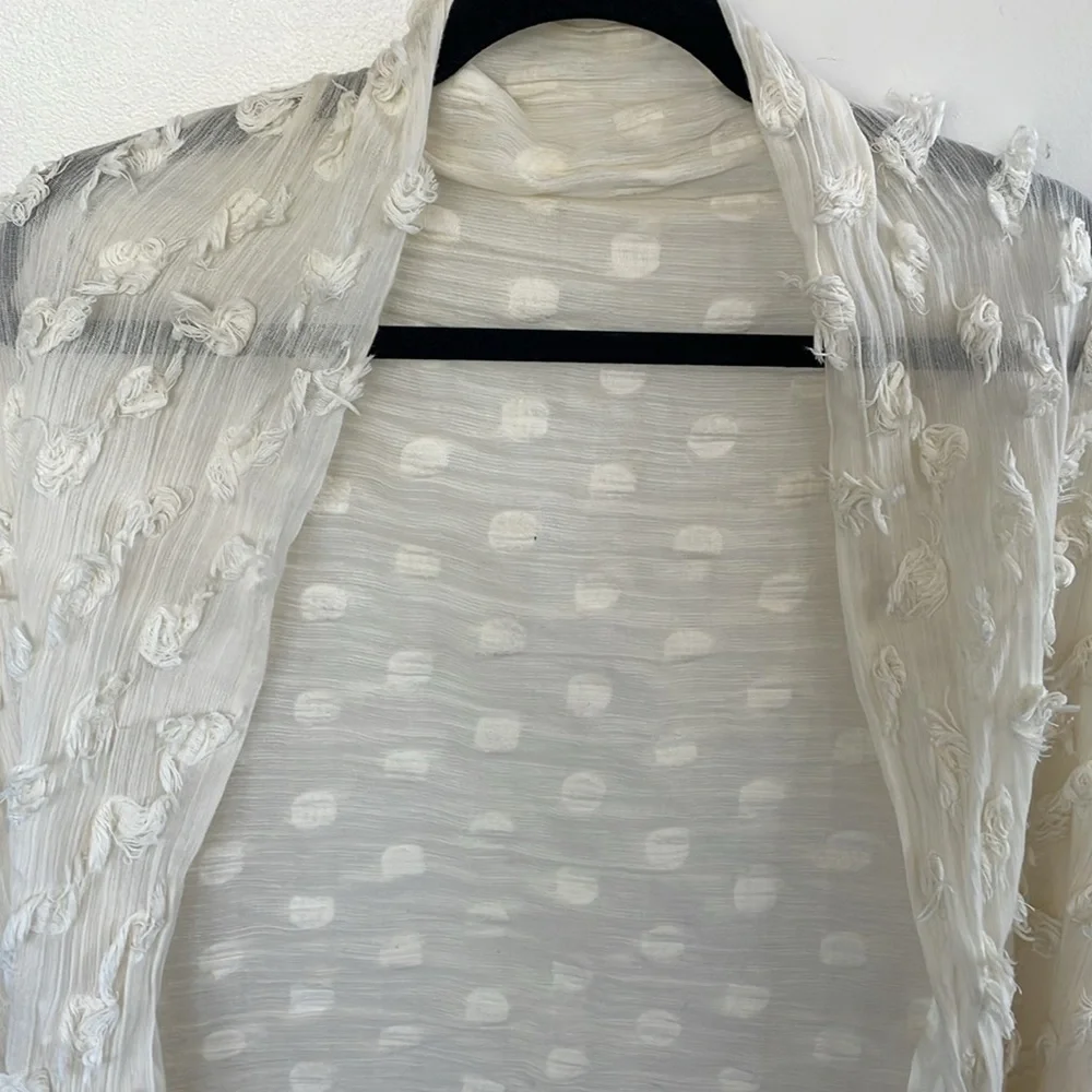Banana Republic cream lightweight scarf or wrap with Pom Pom ball detail.